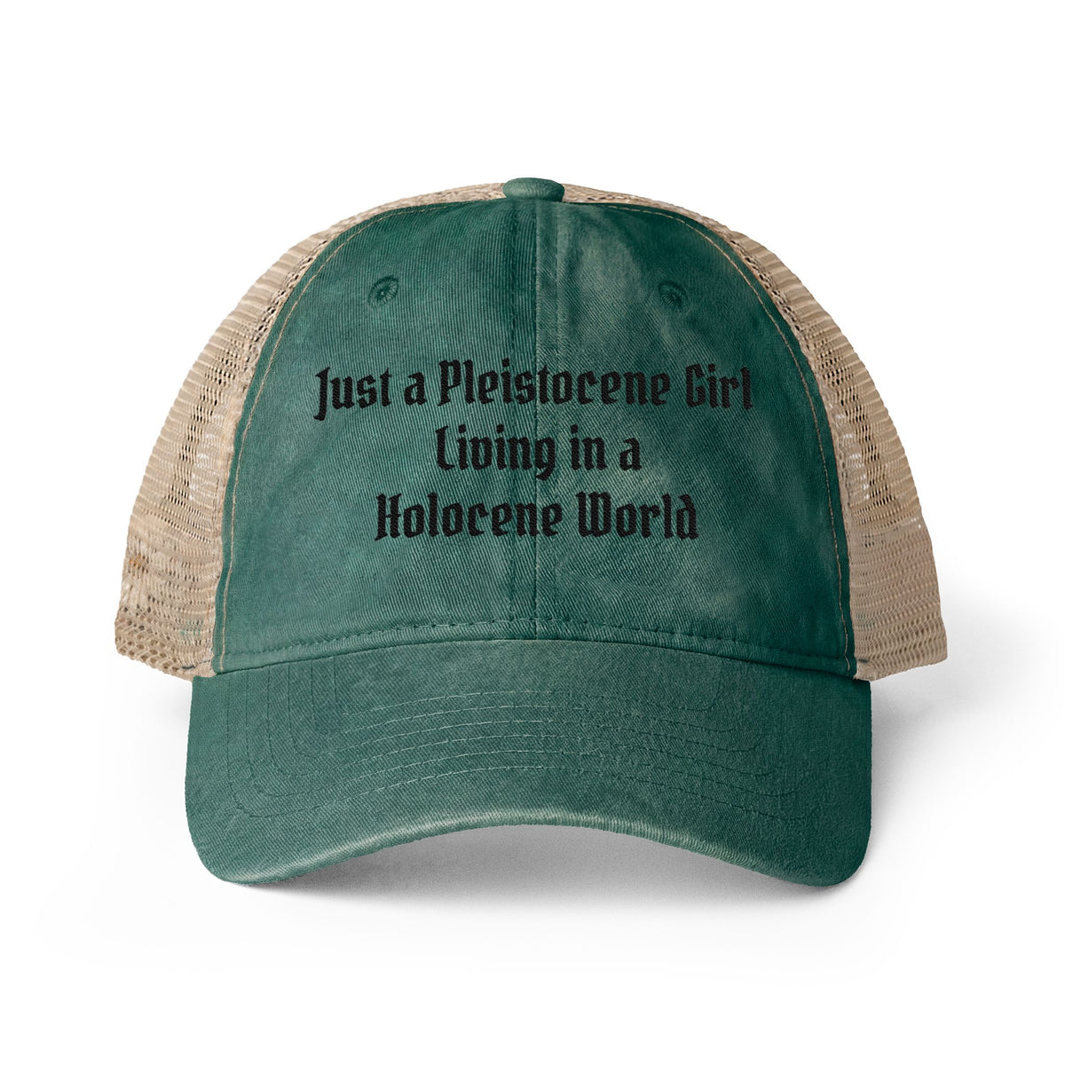 A distressed dark green trucker hat with beige mesh back panels and black embroidered text reading 'Just a Pleistocene Girl Living in a Holocene World' on the front, shown against a plain background.