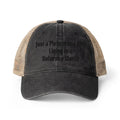 black and beige trucker hat with embroidered "just a Pleistocene girl living in a Holocene world"